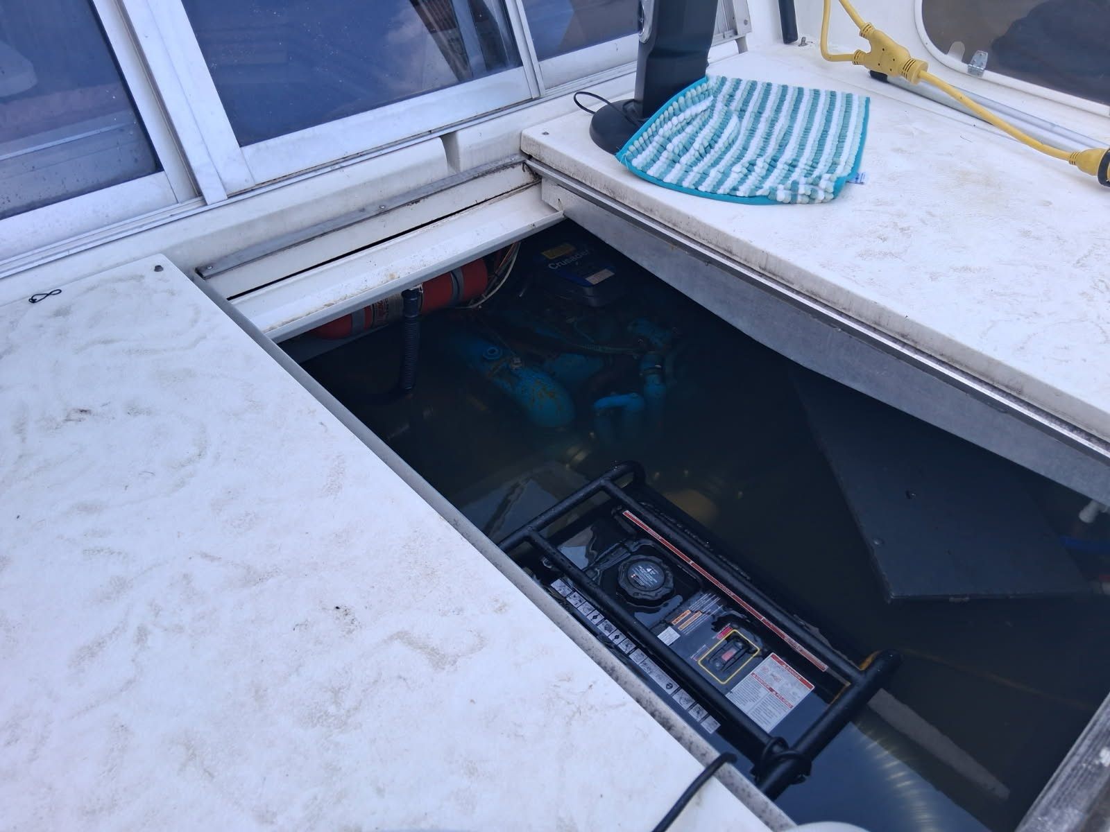 Flooded boat cabin showing water level and salvage conditions